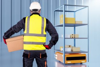 Autonomous warehouse robot. Warehouse automation. Robotic warehouse cart. Automated guided vehicles. Assisting person with AGV. Storage robot